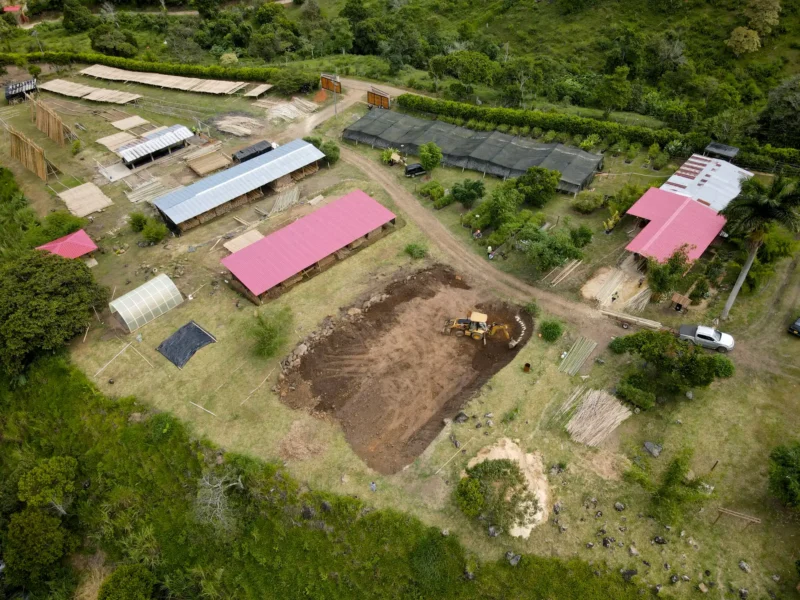 Excavation with backhoe for bamboo pavilion foundation