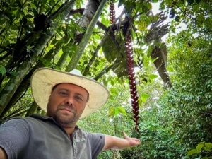 Stéphane Schröder next to the 13-meter Heliconia titanum at Hacienda Guadua Bamboo