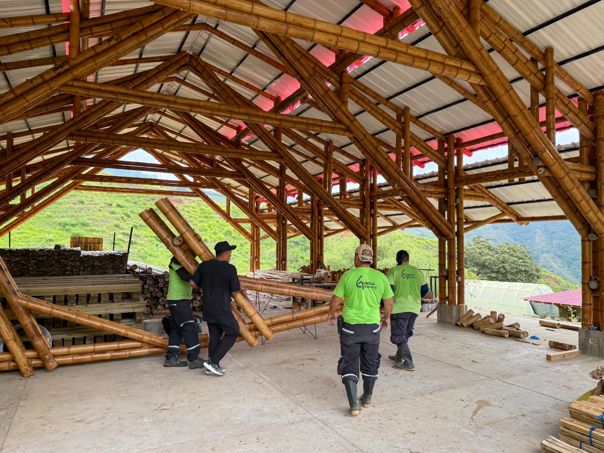 Loading prefabricated bamboo construction elements onto a truck at the Guadua Bamboo facility