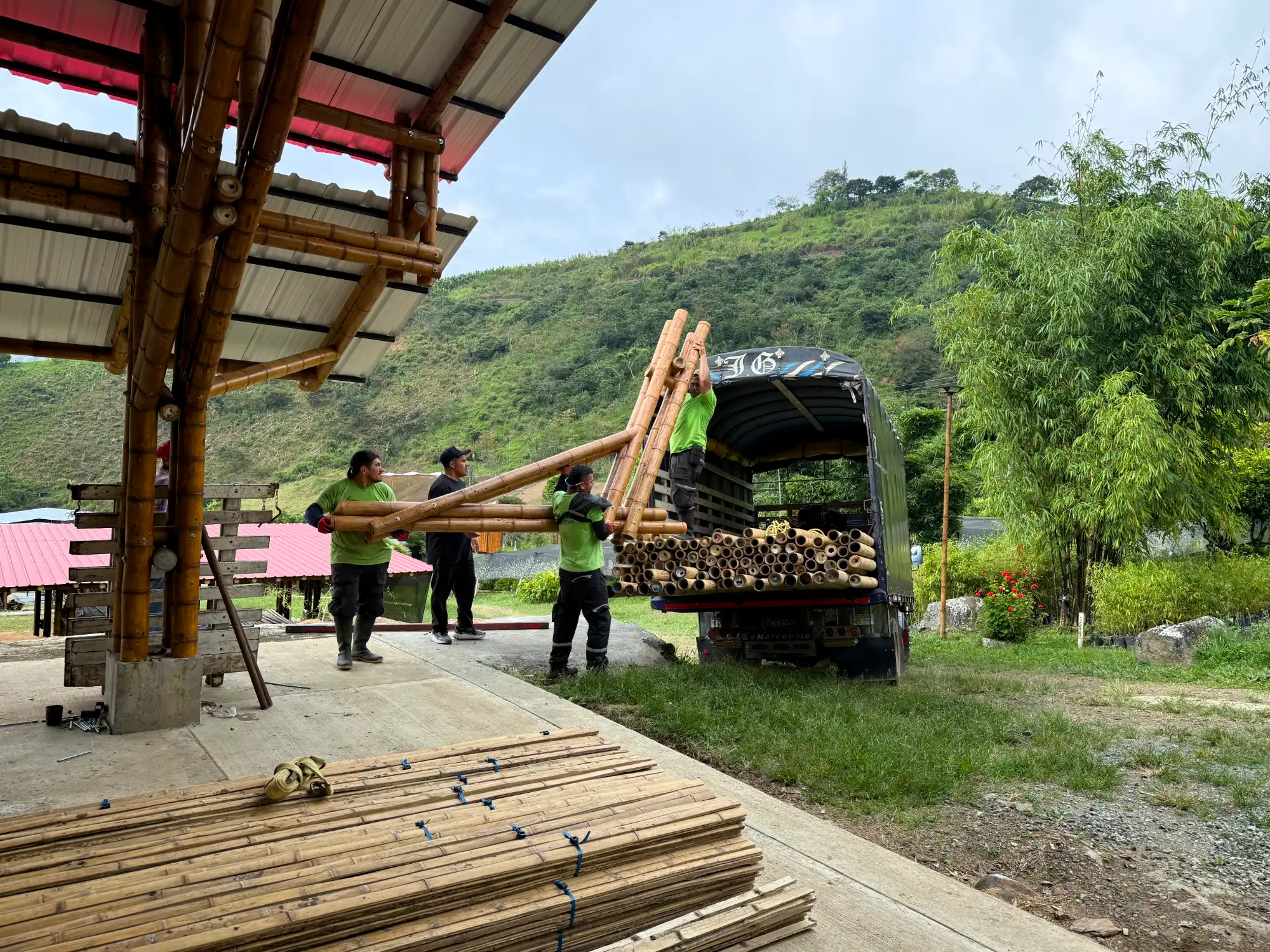 Loading prefabricated bamboo construction elements onto a truck at the Guadua Bamboo facility