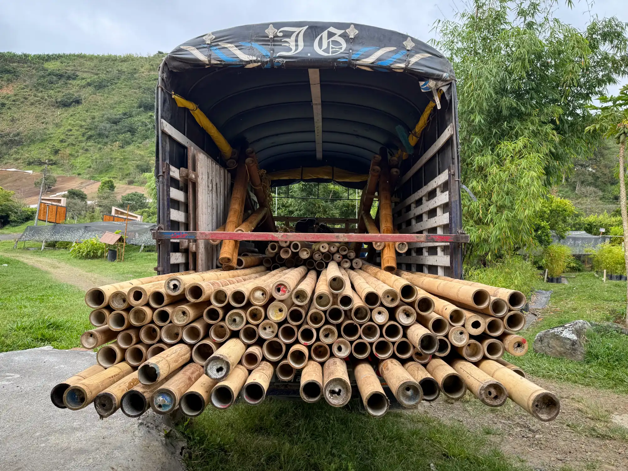 Loading prefabricated bamboo construction elements onto a truck at the Guadua Bamboo facility