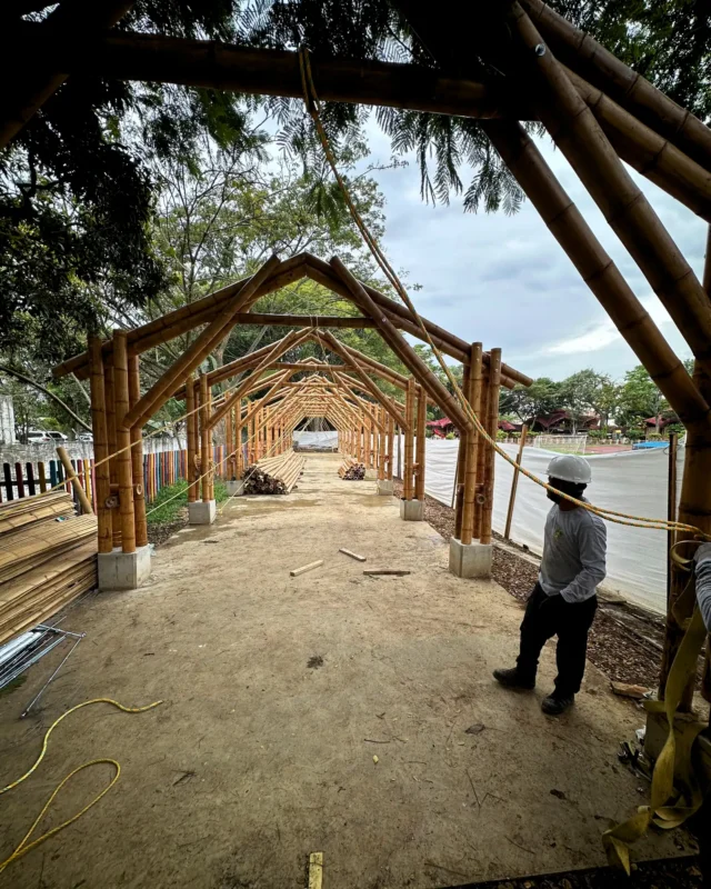 Lifting the prefabricated bamboo structures into position on site
