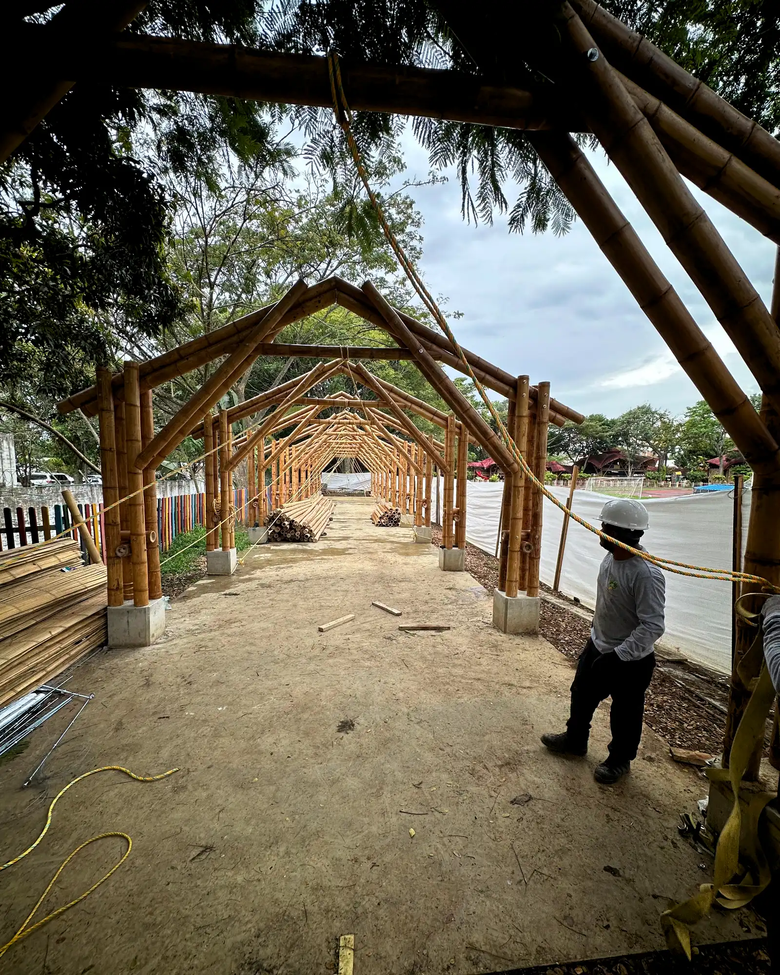 Lifting the prefabricated bamboo structures into position on site
