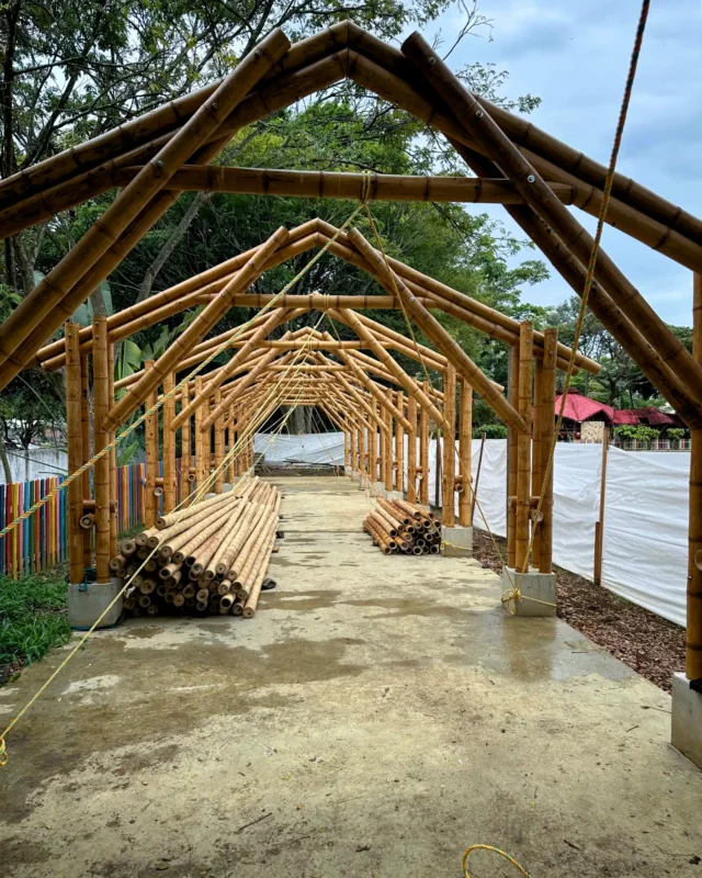 Lifting the prefabricated bamboo structures into position on site