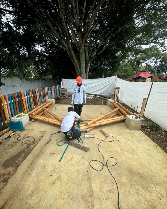 Assembling prefabricated bamboo trusses on the ground prior to installation