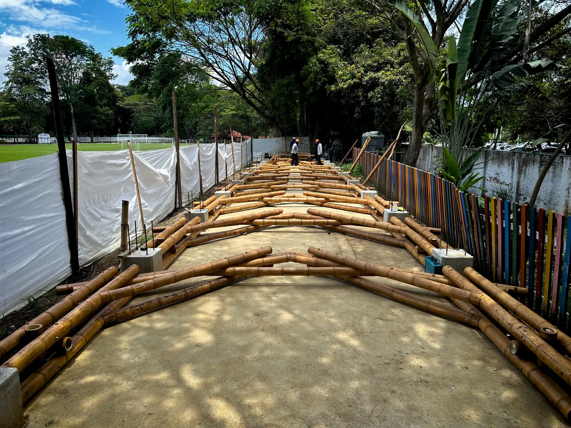 Assembling prefabricated bamboo trusses on the ground prior to installation